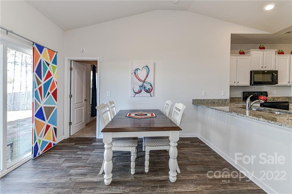 6727 Jerimoth Charlotte, NC 28215 - Photo 13 of 30 a living room with furniture and a flat screen tv