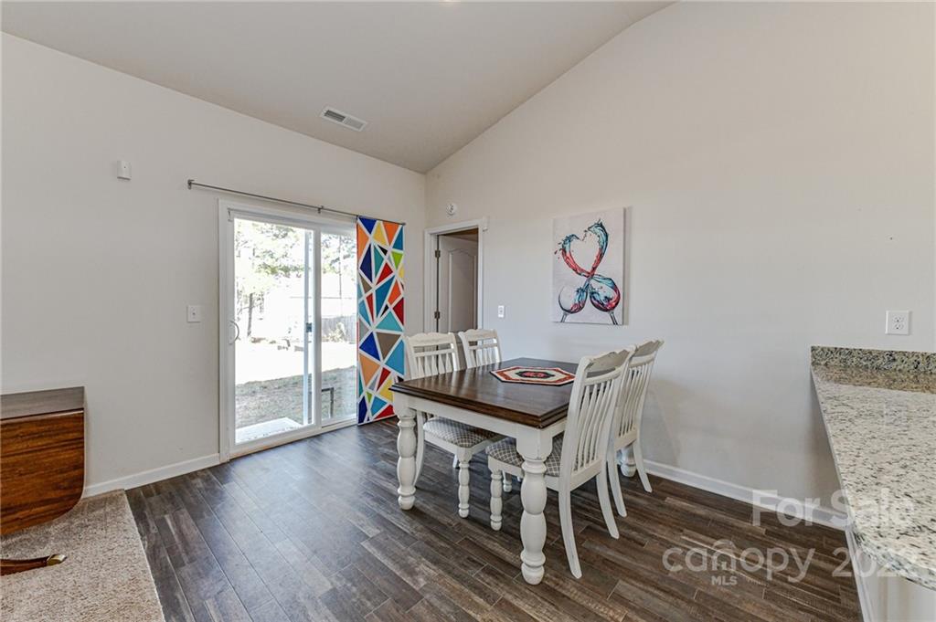 6727 Jerimoth Charlotte, NC 28215 - Photo 14 of 30 a view of a livingroom with furniture window and wooden floor