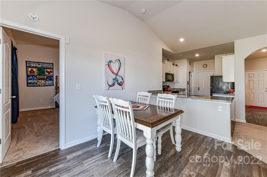 6727 Jerimoth Charlotte, NC 28215 - Photo 15 of 30 a kitchen with a table and chairs in it