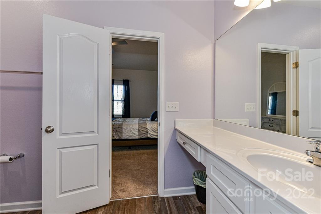 6727 Jerimoth Charlotte, NC 28215 - Photo 20 of 30 a bathroom with a granite countertop sink and a mirror