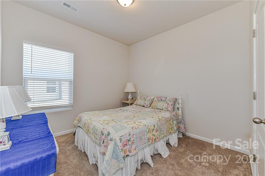 6727 Jerimoth Charlotte, NC 28215 - Photo 21 of 30 a bedroom with a bed and wooden floor