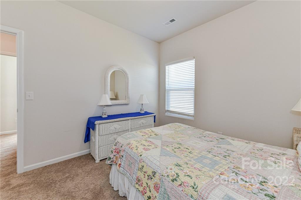 6727 Jerimoth Charlotte, NC 28215 - Photo 23 of 30 a bedroom with a bed and a window