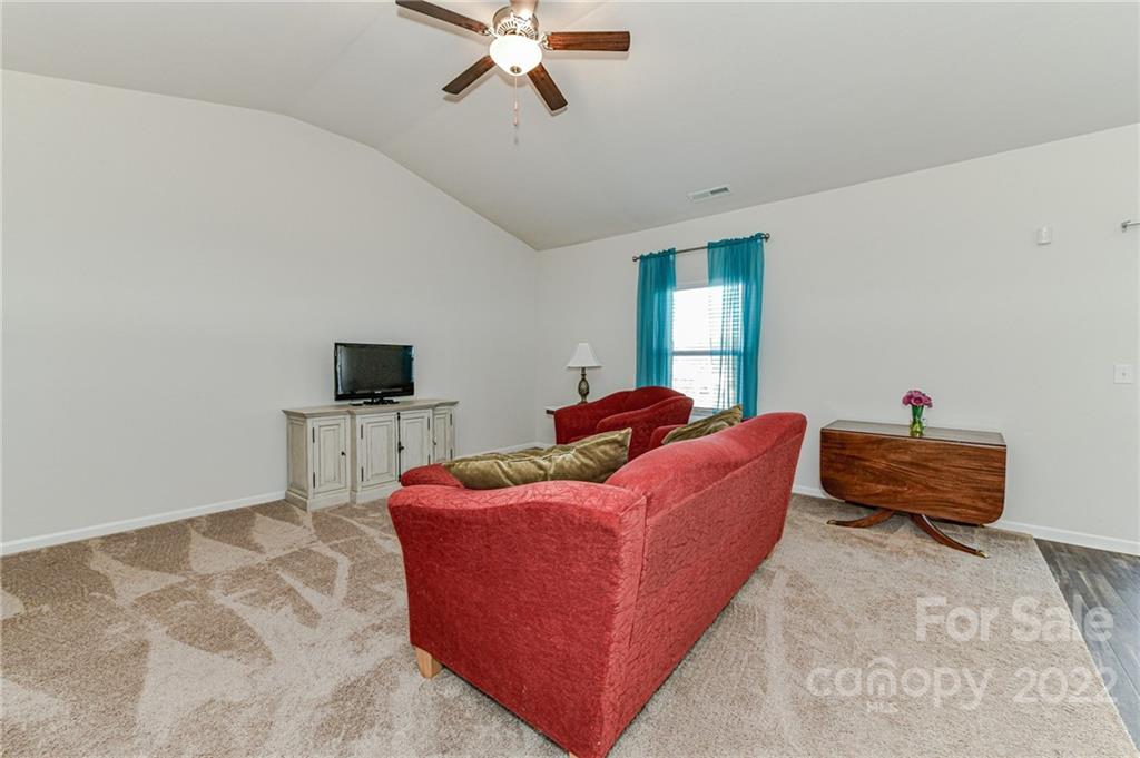 6727 Jerimoth Charlotte, NC 28215 - Photo 6 of 30 a living room with furniture and a flat screen tv