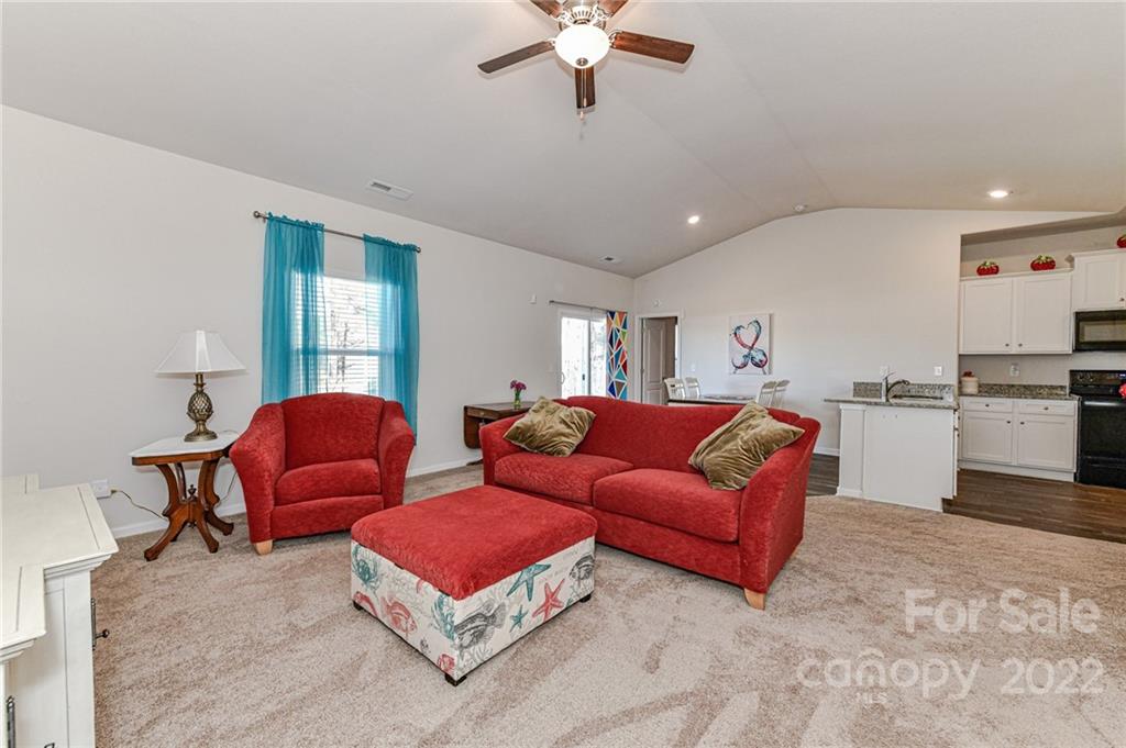 6727 Jerimoth Charlotte, NC 28215 - Photo 7 of 30 a living room with furniture and kitchen view