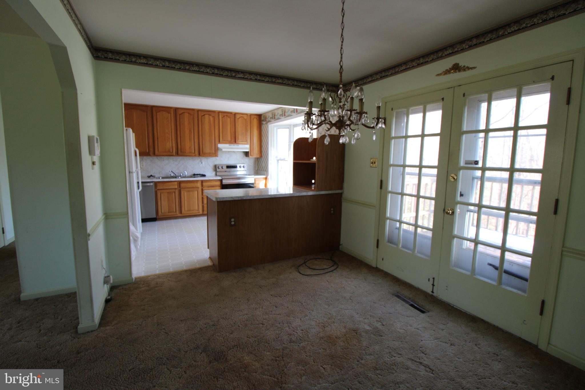 29778 Oak Road Mechanicsville, MD 20659 - Photo 9 of 22 a view of a kitchen and a refrigerator