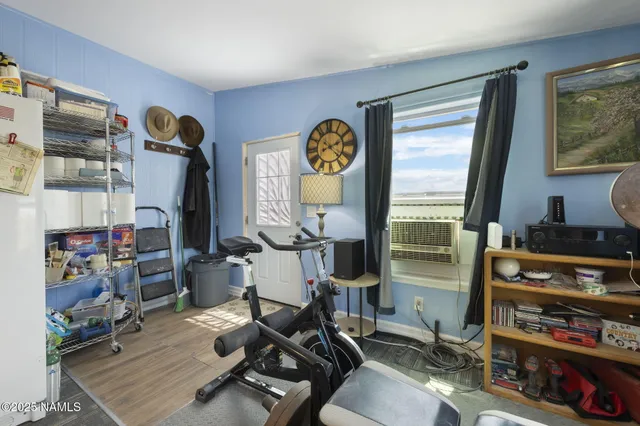 a room with gym equipment and a window