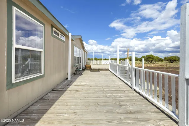 a view of house with outdoor space and sitting area