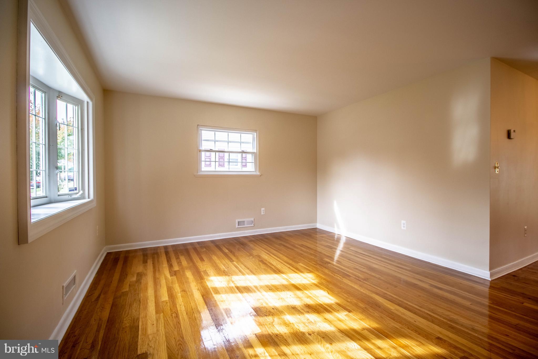 1213 Canberwell Road Baltimore, MD 21228 - Photo 2 of 30 Sun-filled Living Room Hardwood Floors!