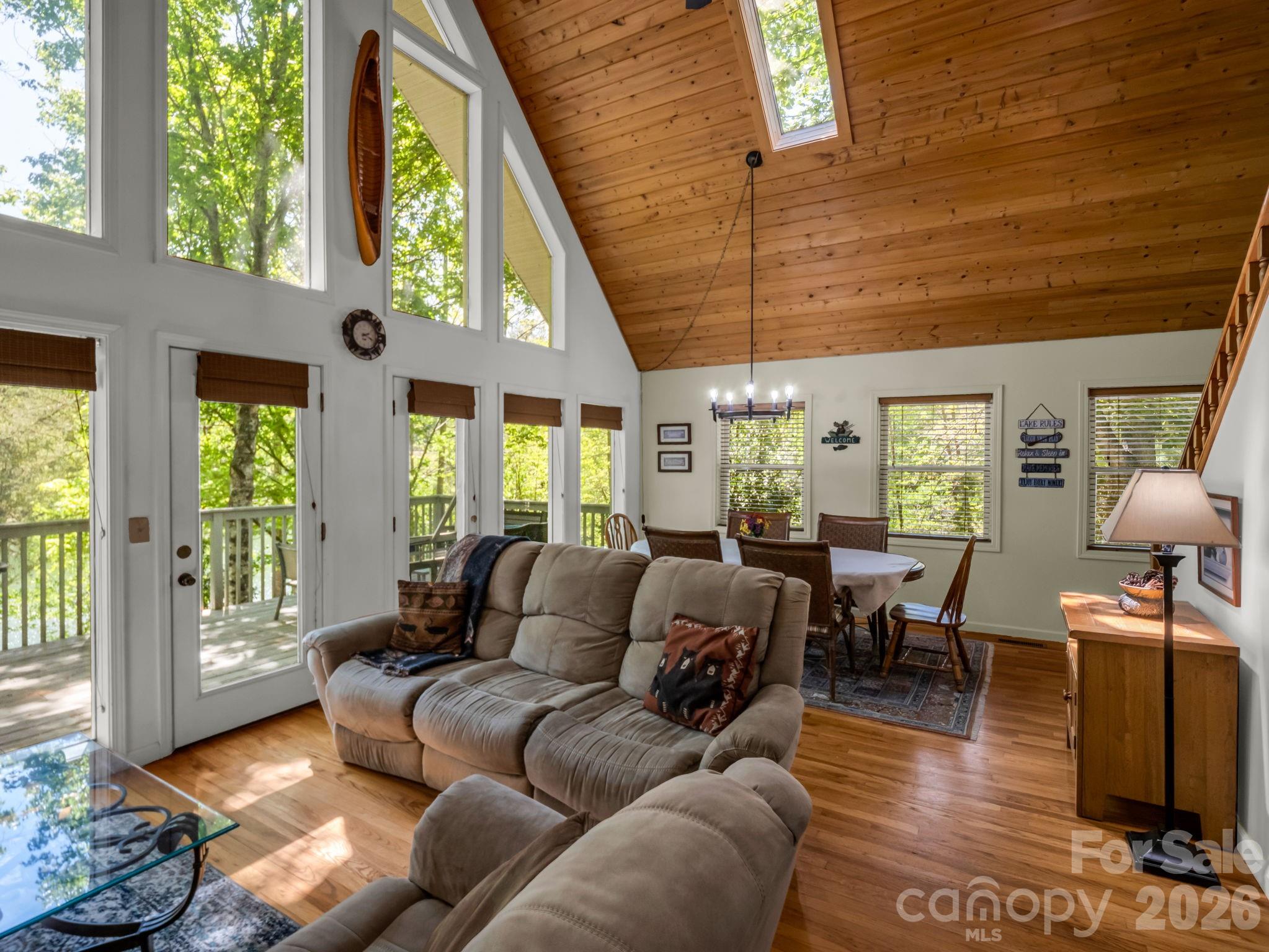 268 Mallard Road Lake Lure, NC 28746 - Photo 12 of 44 a living room with furniture and large windows