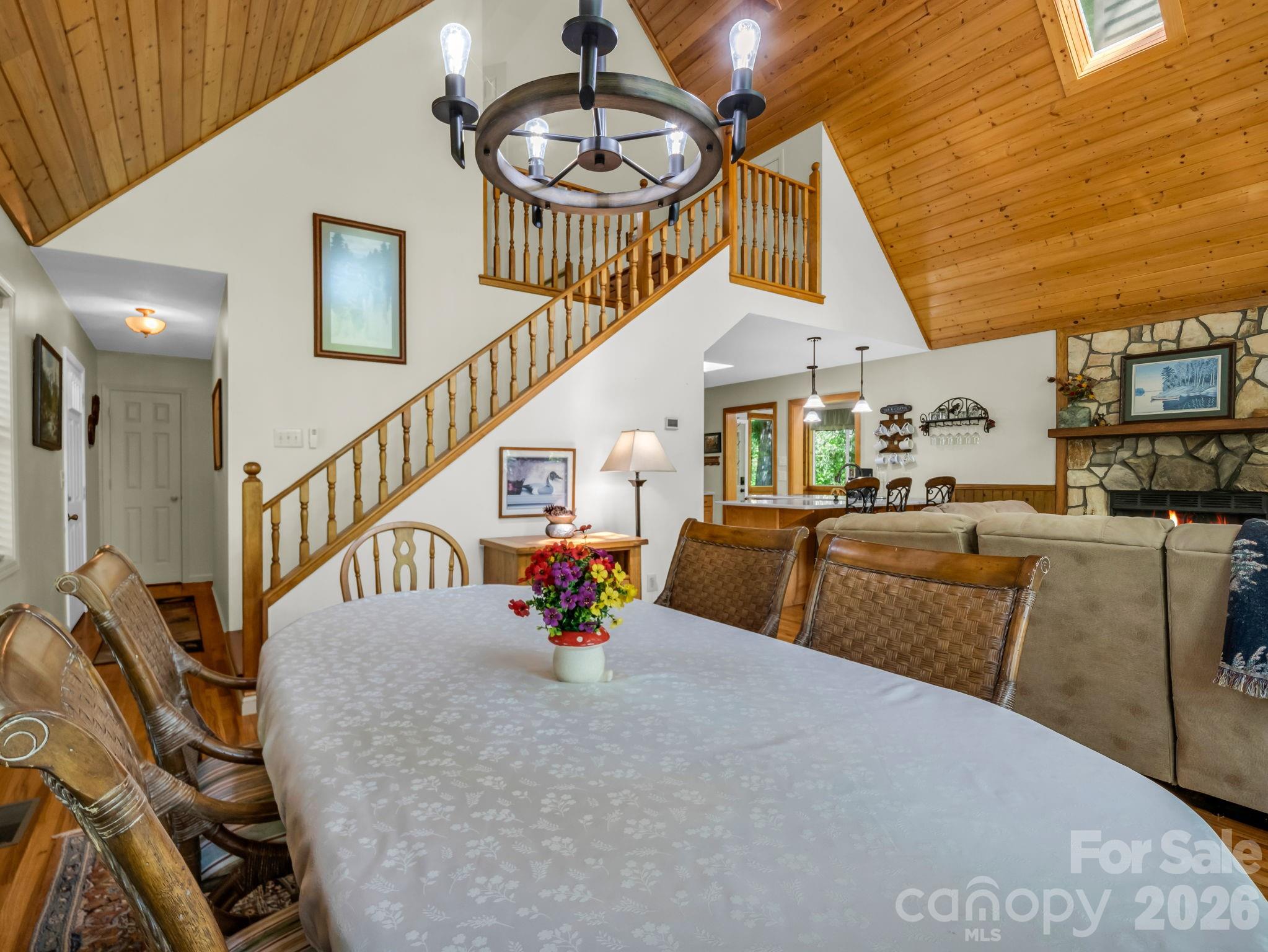 268 Mallard Road Lake Lure, NC 28746 - Photo 16 of 44 a dining room with furniture and a chandelier