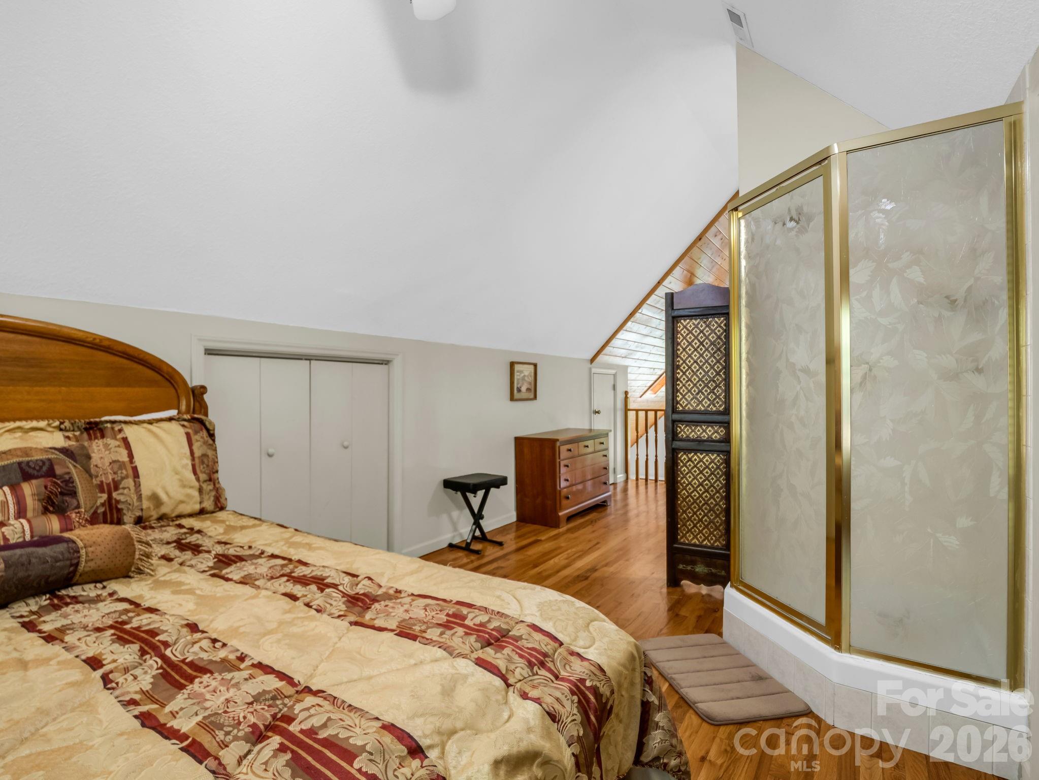 268 Mallard Road Lake Lure, NC 28746 - Photo 25 of 44 a bedroom with a bed and a dresser