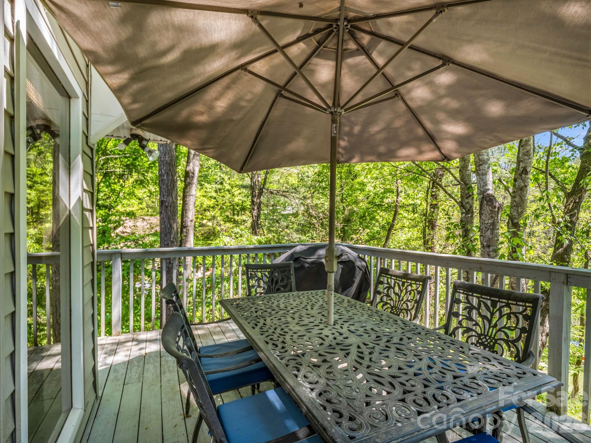 268 Mallard Road Lake Lure, NC 28746 - Photo 28 of 44 a view of balcony with furniture and umbrella