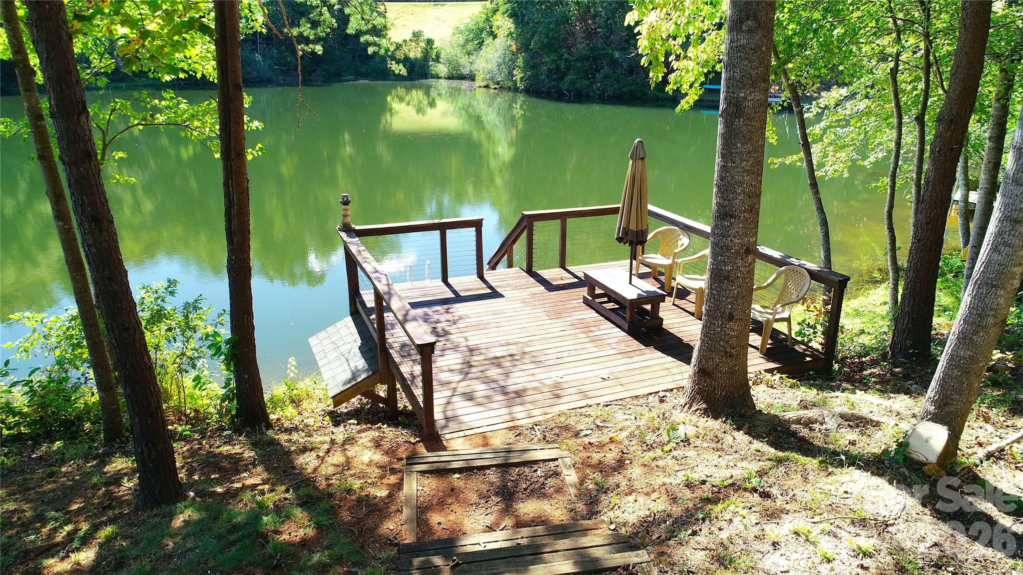 268 Mallard Road Lake Lure, NC 28746 - Photo 3 of 44 a view of a swimming pool with a patio and a yard