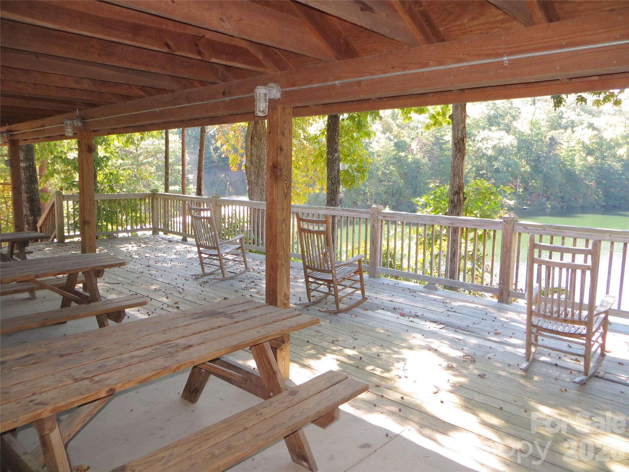 268 Mallard Road Lake Lure, NC 28746 - Photo 40 of 44 a view of a living room and floor to ceiling window with wooden floor