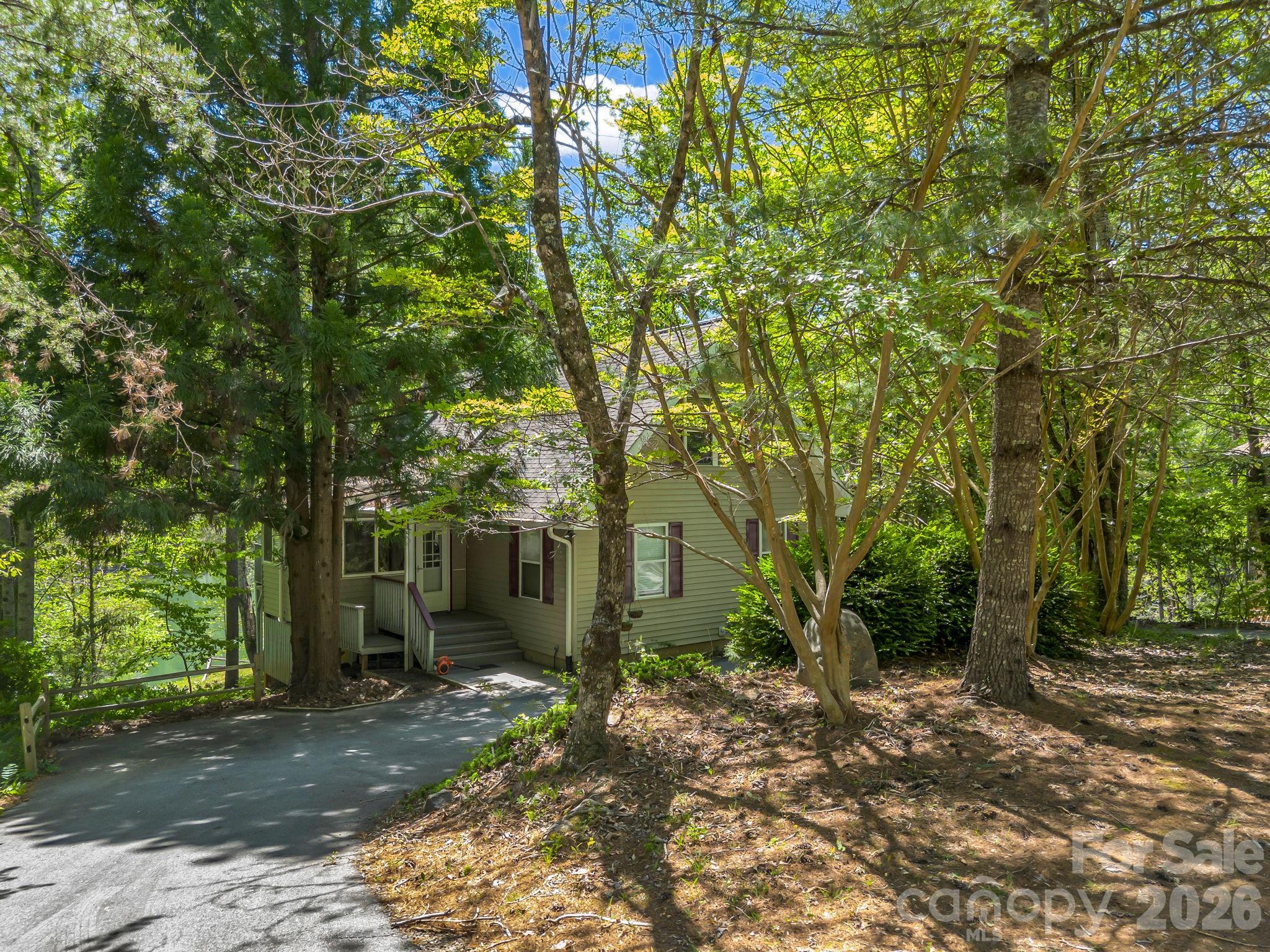 268 Mallard Road Lake Lure, NC 28746 - Photo 8 of 44 a view of a house with a tree