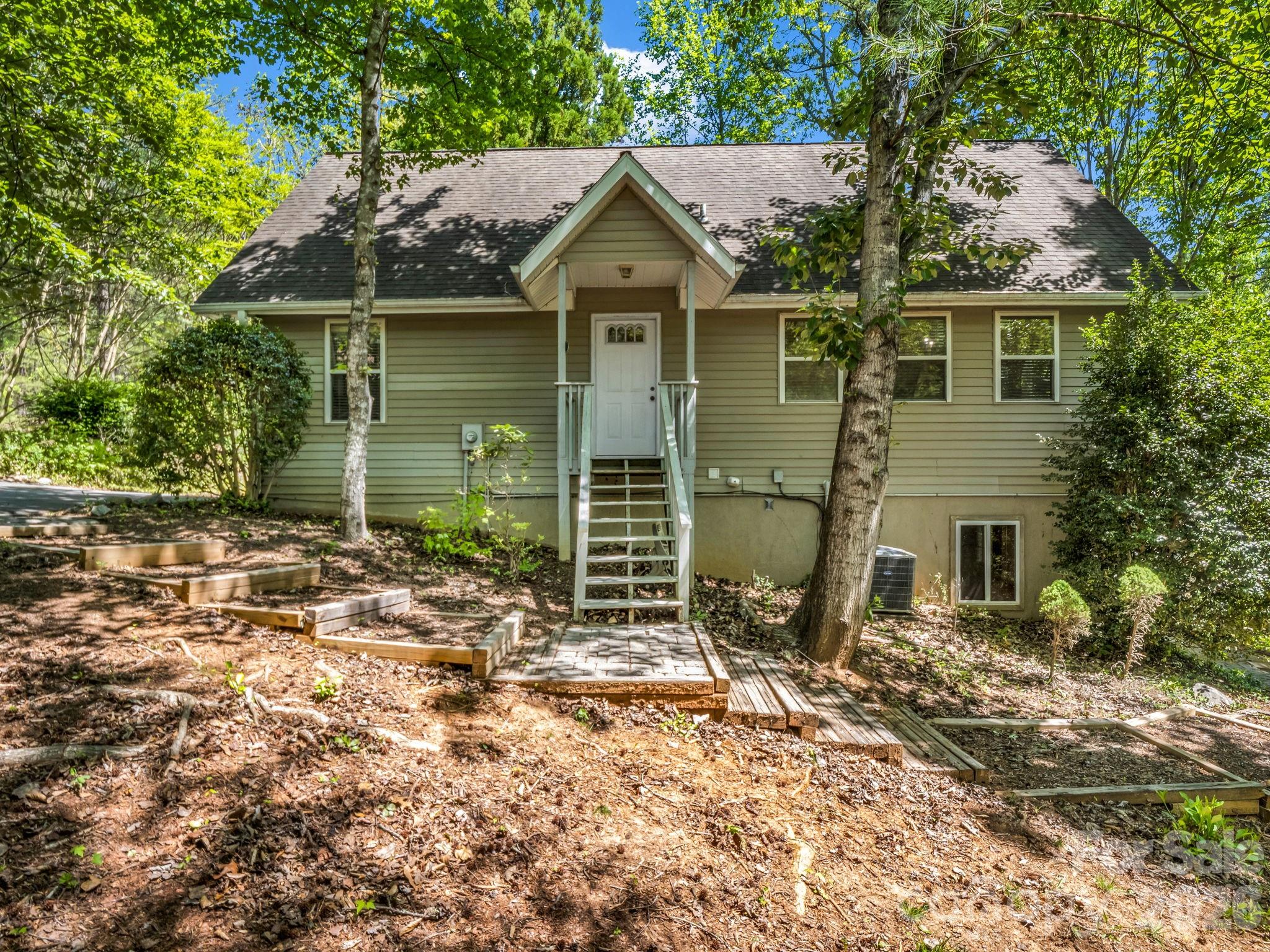268 Mallard Road Lake Lure, NC 28746 - Photo 10 of 44 front view of a house with a small yard