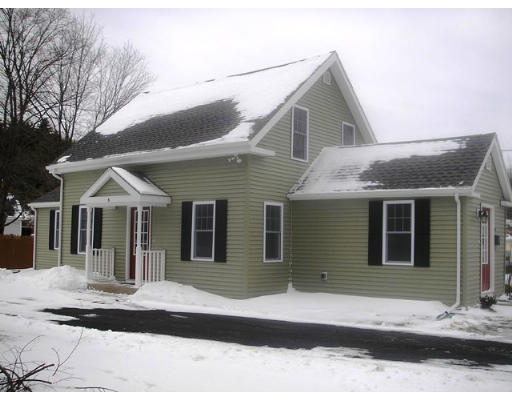 6 Morse Road Sutton, MA 01590 - Photo 1 of 16 a front view of a house with garage
