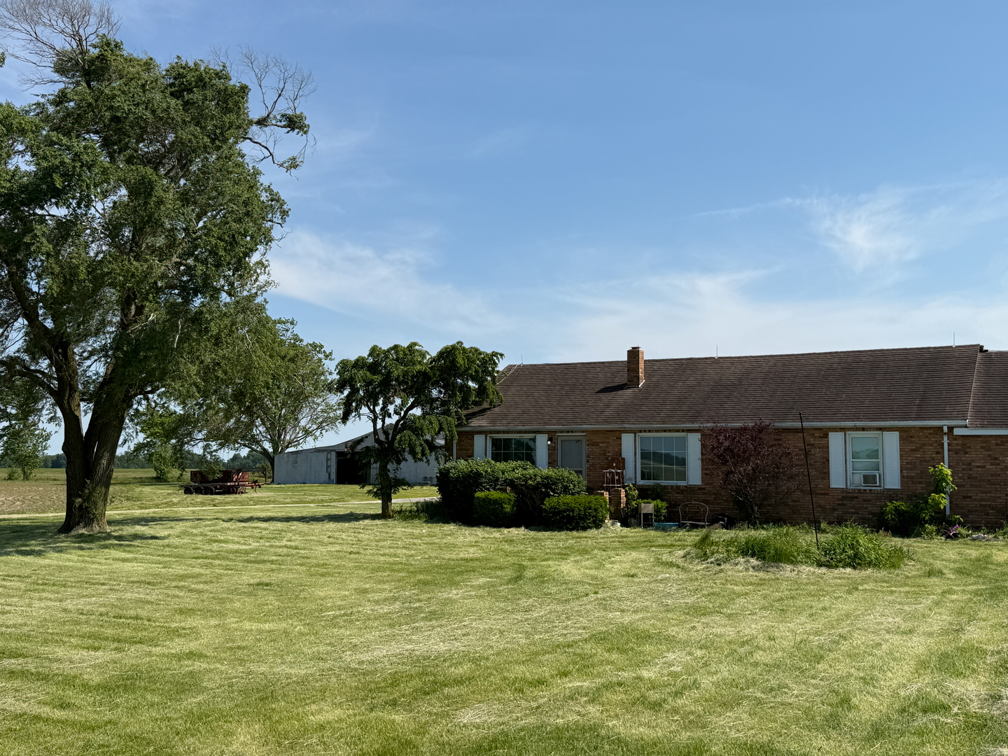 5991 Kinmundy Road Louisville, IL 62858 - Photo 2 of 12 a front view of a house with a garden