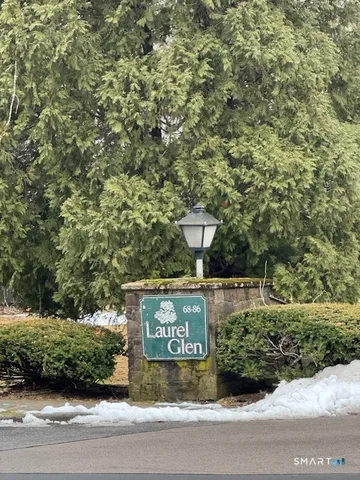 a view of outdoor space with signage and flags