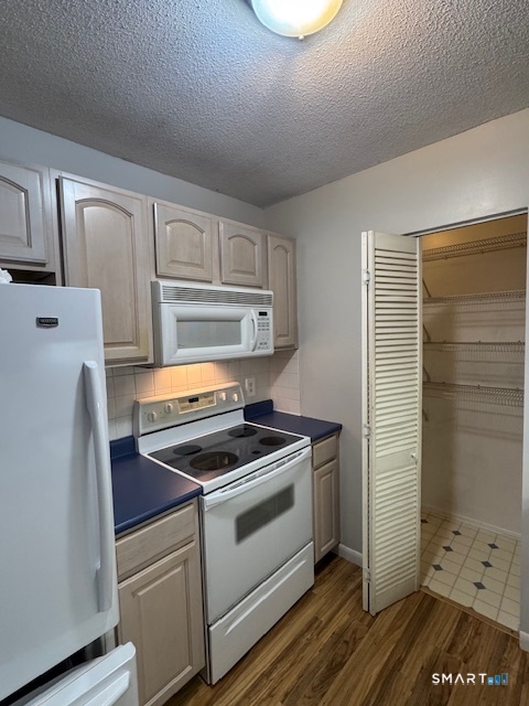 a kitchen with a stove and a refrigerator