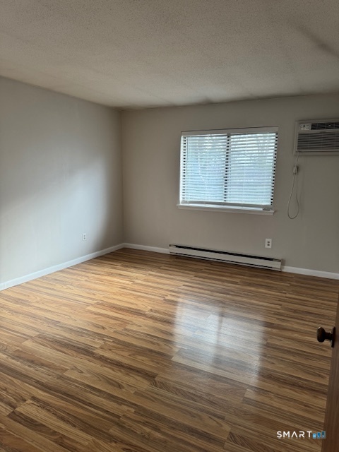 74 Buddington Road, Unit 7 Groton, CT 06340 - Photo 11 of 19 wooden floor in an empty room