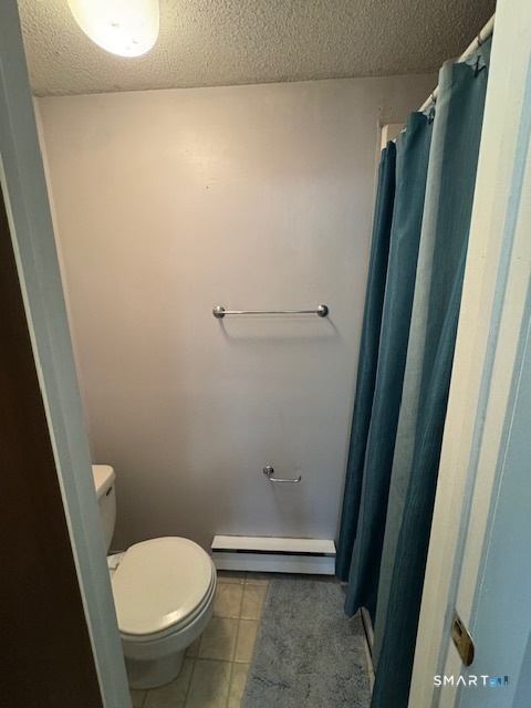 74 Buddington Road, Unit 7 Groton, CT 06340 - Photo 15 of 19 a bathroom with a toilet and a shower