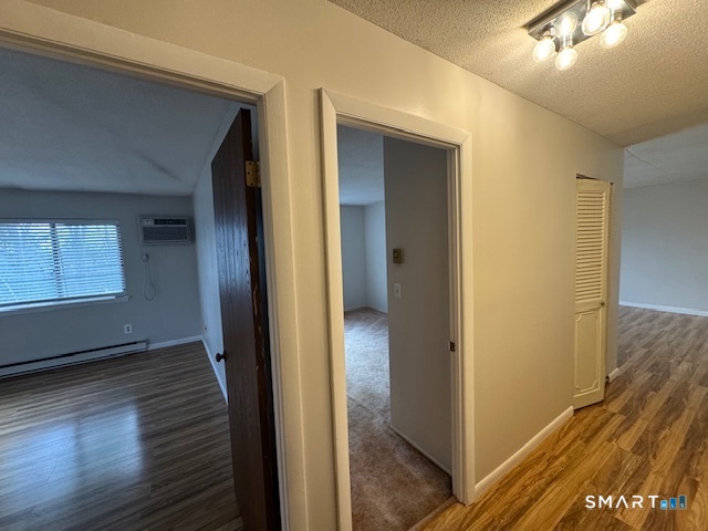 74 Buddington Road, Unit 7 Groton, CT 06340 - Photo 16 of 19 a view of a hallway with wooden floor