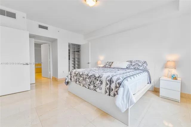 a bedroom with a bed and a cabinets