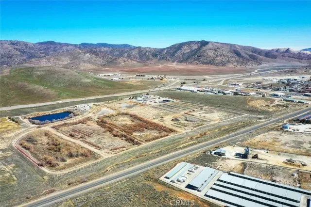a view of a lake with houses in the background