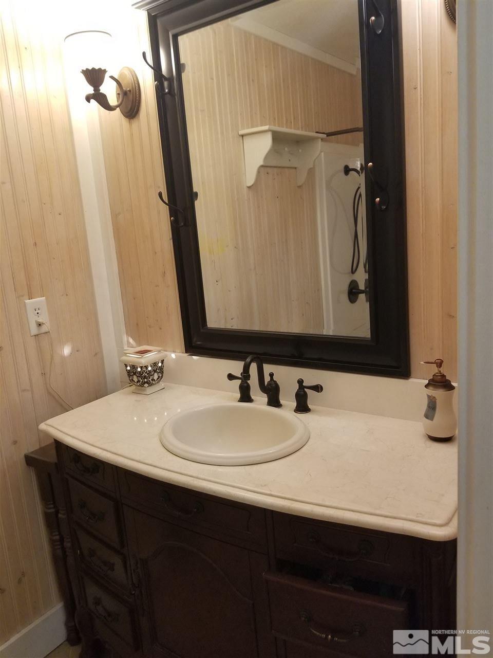 2555 Soda Lake Road Fallon, NV 89406 - Photo 27 of 40 a bathroom with a sink and a mirror