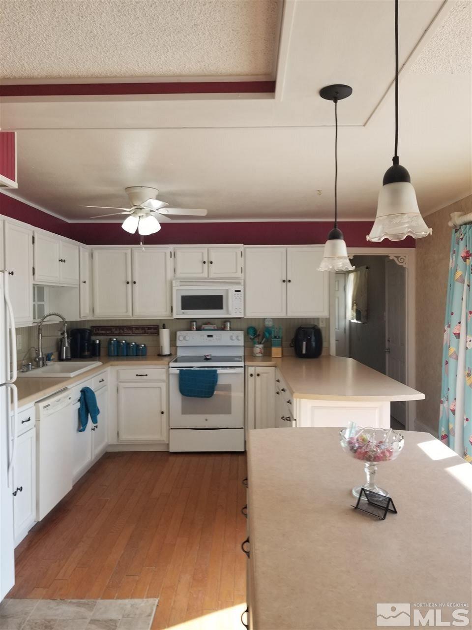 2555 Soda Lake Road Fallon, NV 89406 - Photo 8 of 40 a kitchen with a sink a stove and cabinets