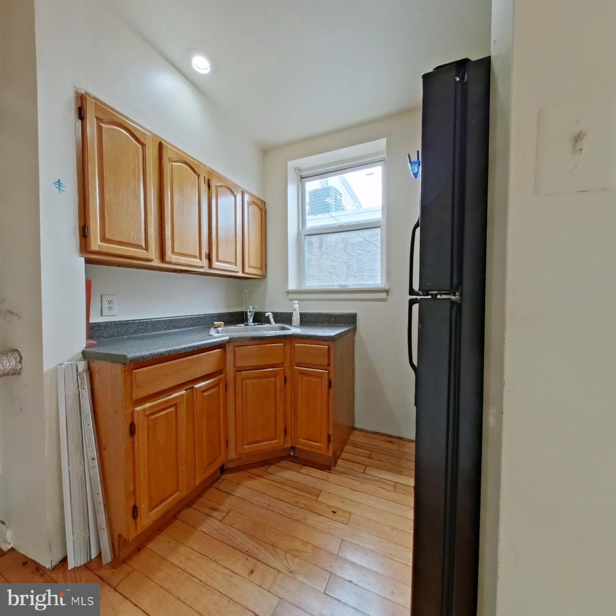 1422 Willington Street, Unit 2 Philadelphia, PA 19121 - Photo 12 of 25 a kitchen with stainless steel appliances granite countertop a refrigerator and a sink