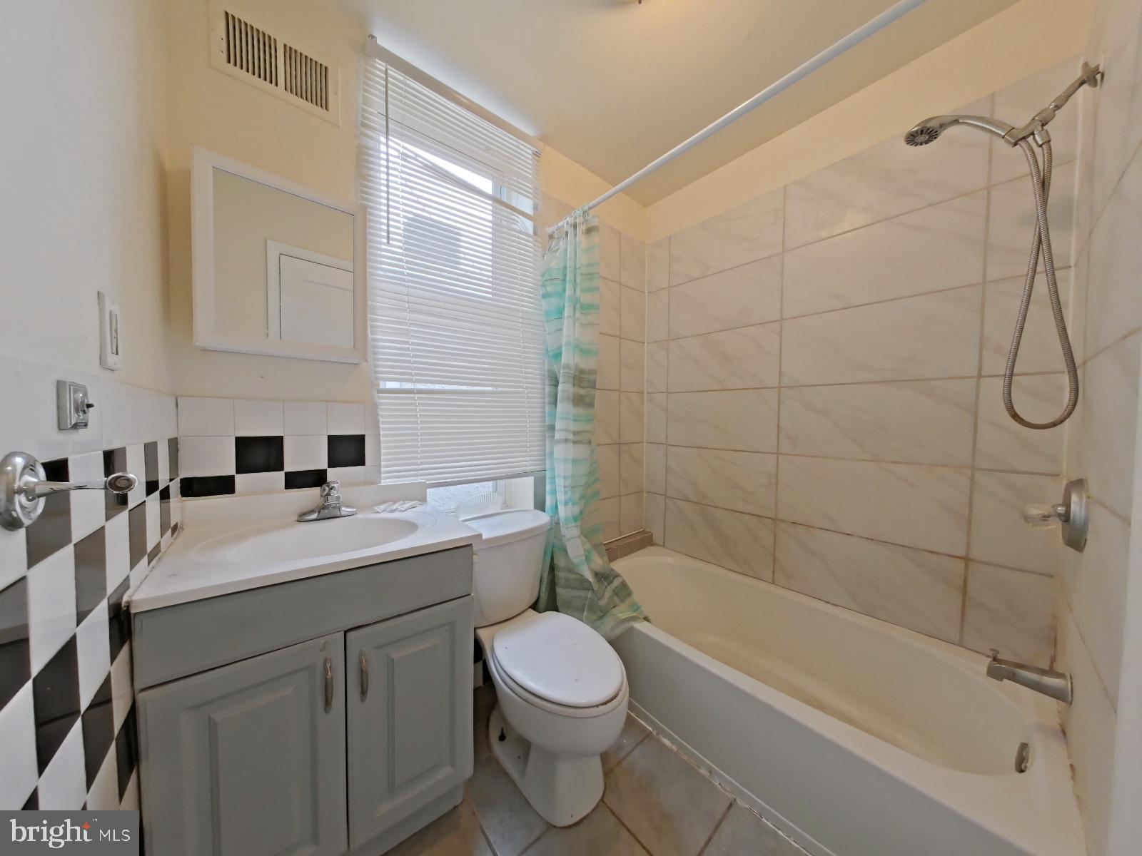 1422 Willington Street, Unit 2 Philadelphia, PA 19121 - Photo 14 of 25 a bathroom with a sink a toilet and shower