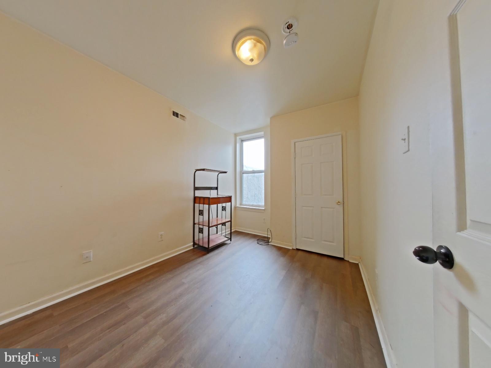 1422 Willington Street, Unit 2 Philadelphia, PA 19121 - Photo 16 of 25 a view of empty room with wooden floor