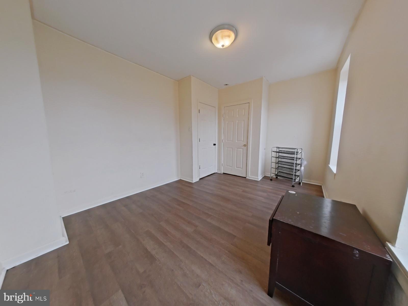 1422 Willington Street, Unit 2 Philadelphia, PA 19121 - Photo 19 of 25 a room with a bed and cabinets