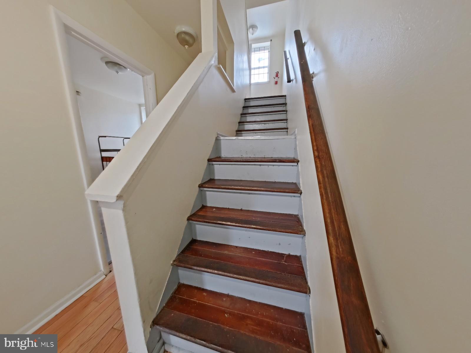 1422 Willington Street, Unit 2 Philadelphia, PA 19121 - Photo 20 of 25 a view of staircase with wooden floor and white walls