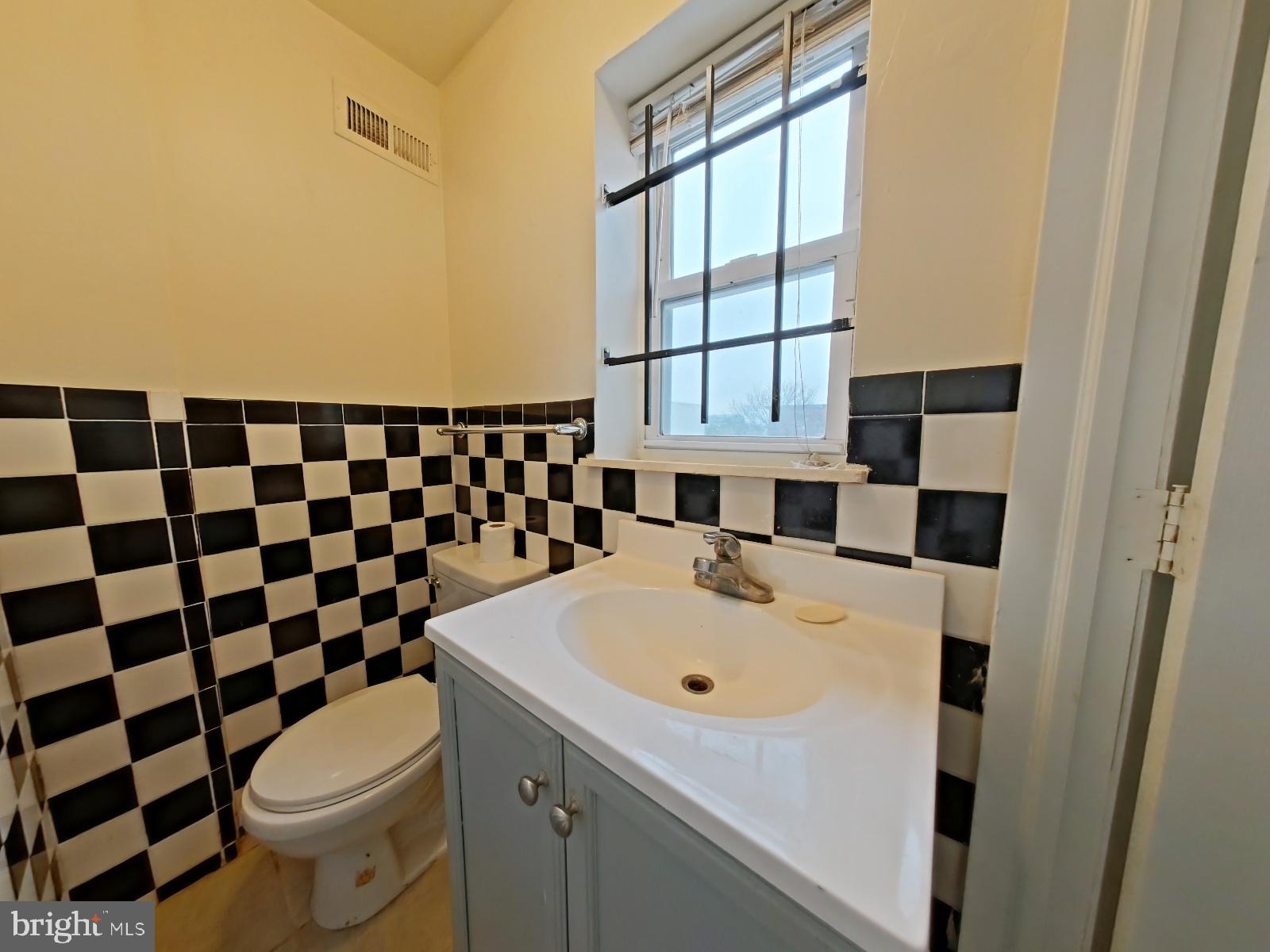 1422 Willington Street, Unit 2 Philadelphia, PA 19121 - Photo 21 of 25 a bathroom with a sink toilet and shower