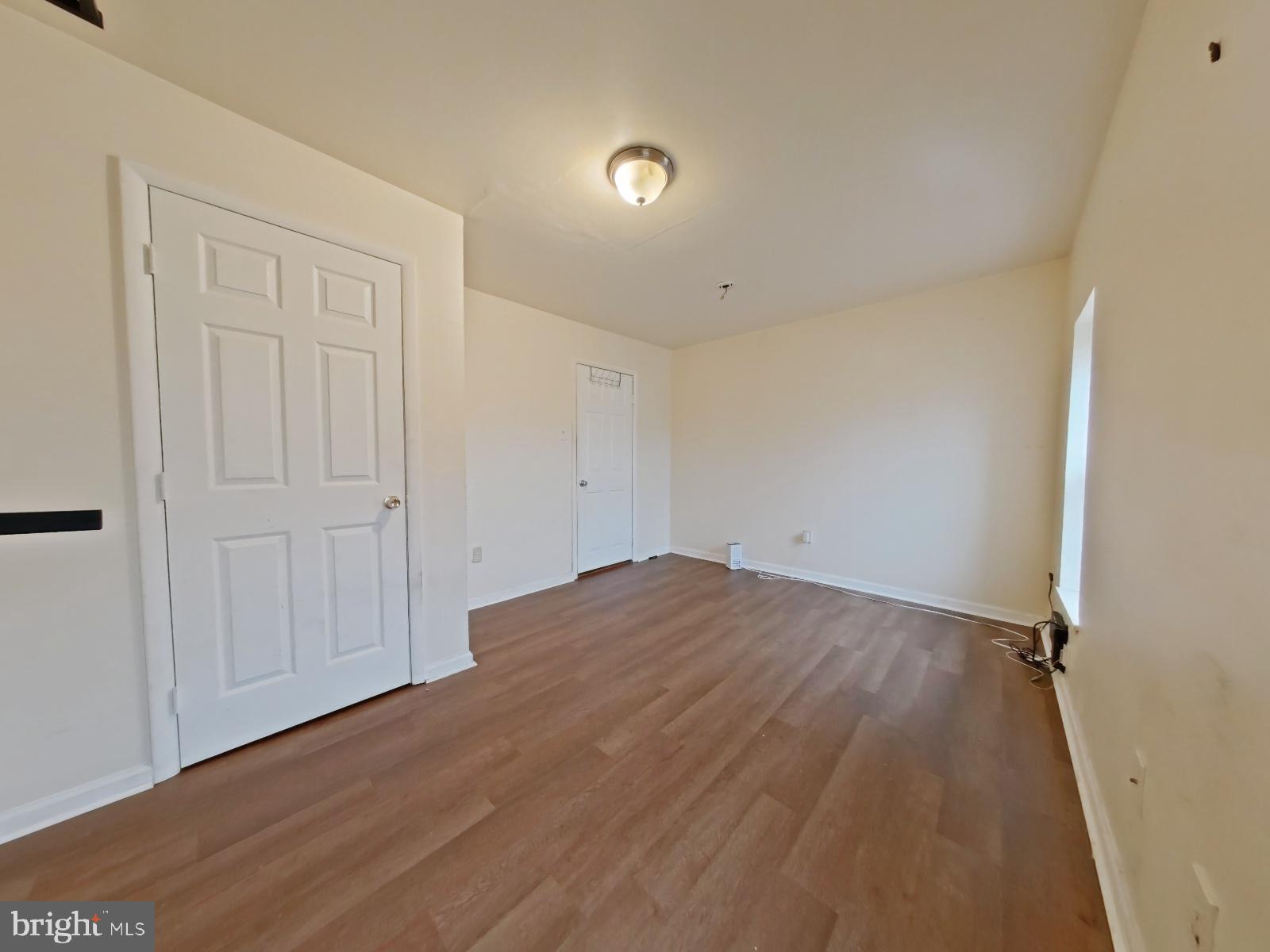 1422 Willington Street, Unit 2 Philadelphia, PA 19121 - Photo 25 of 25 an empty room with wooden floor