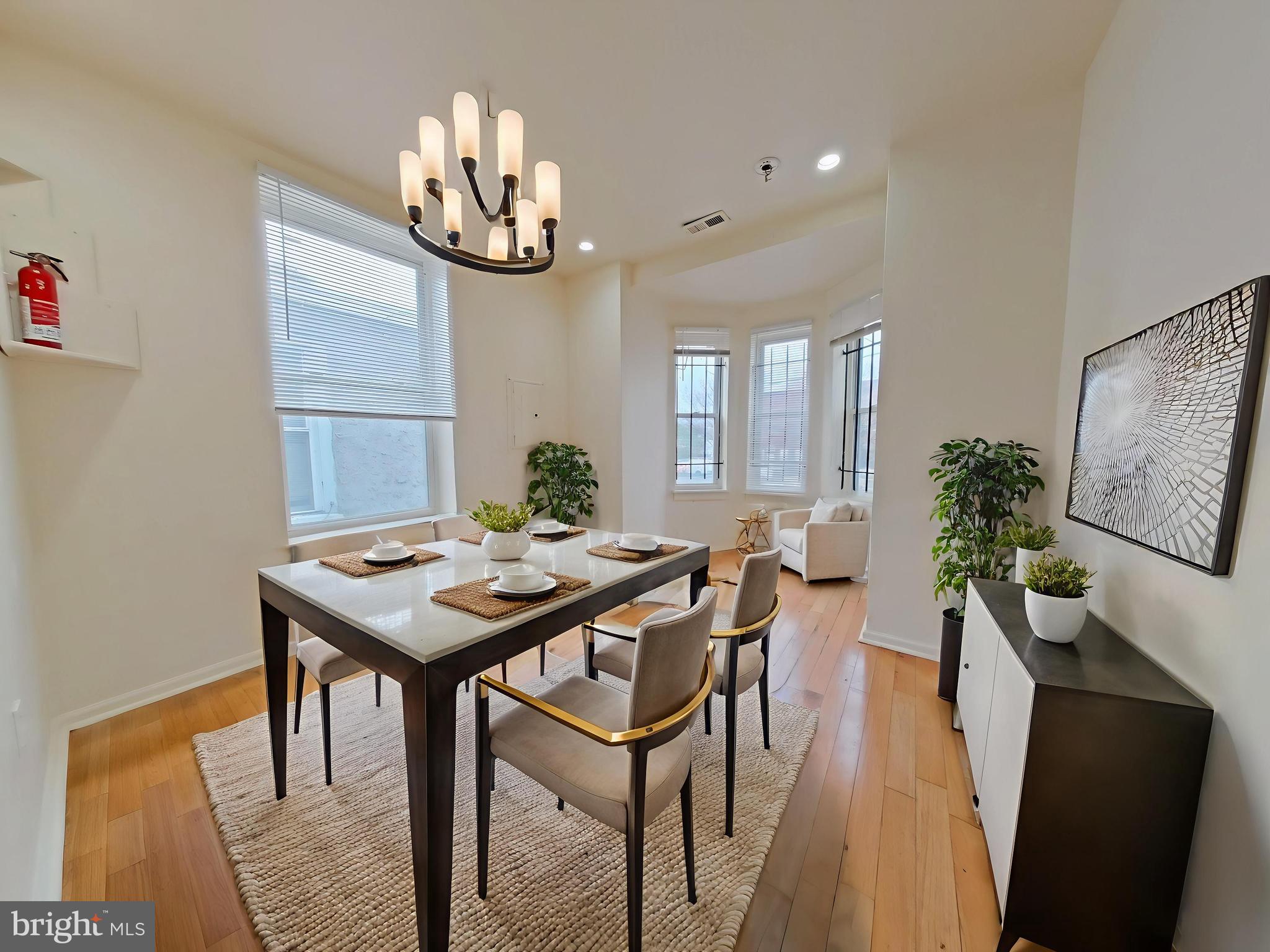 1422 Willington Street, Unit 2 Philadelphia, PA 19121 - Photo 3 of 25 a view of a dining room with furniture a chandelier and wooden floor