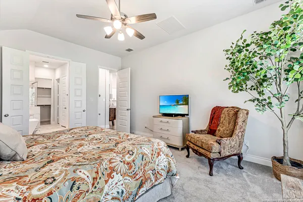 a bedroom with furniture and a bed