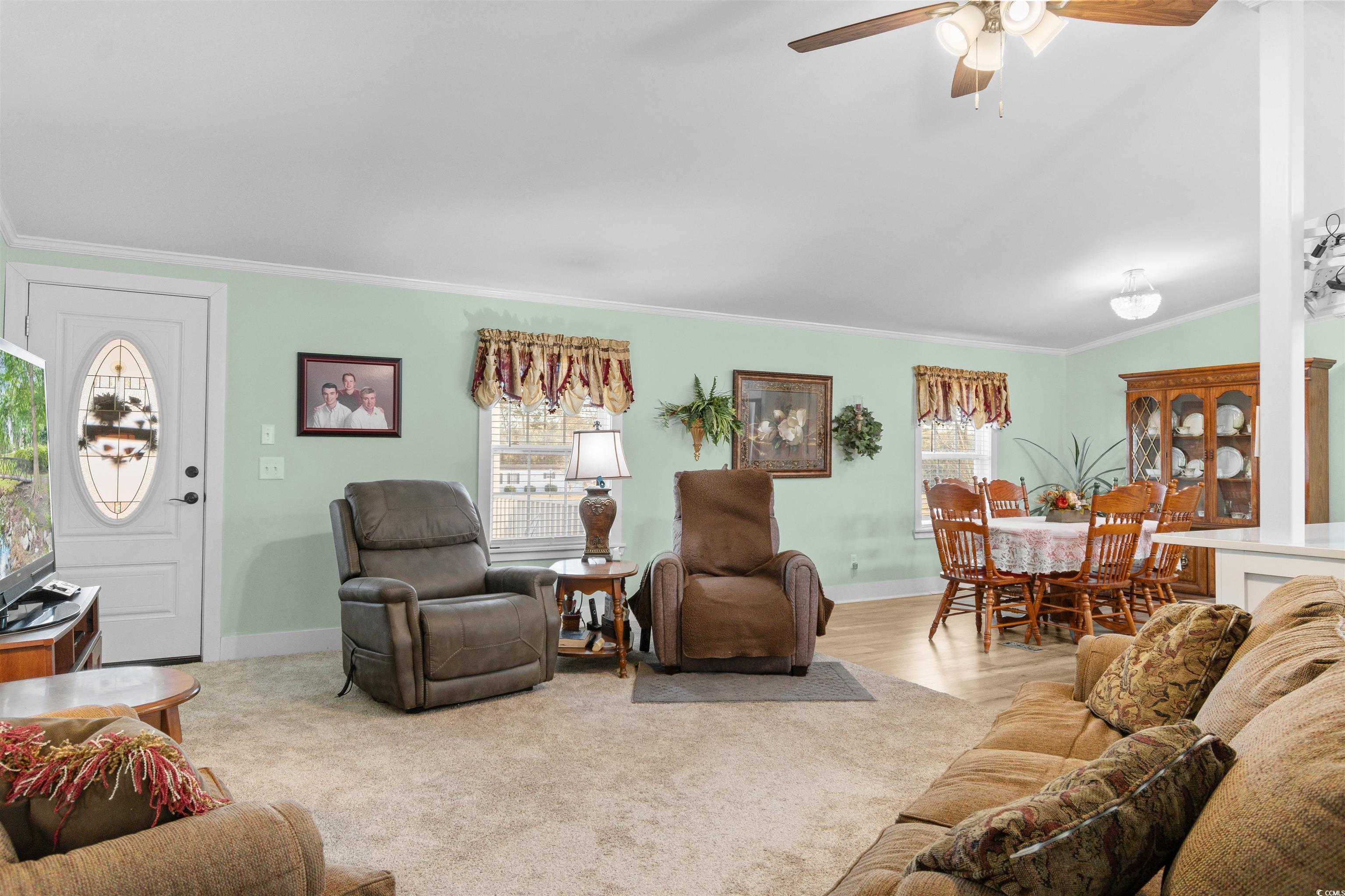 4065 Highway 66 Loris, SC 29569 - Photo 9 of 40 Living room with ornamental molding and a ceiling fan