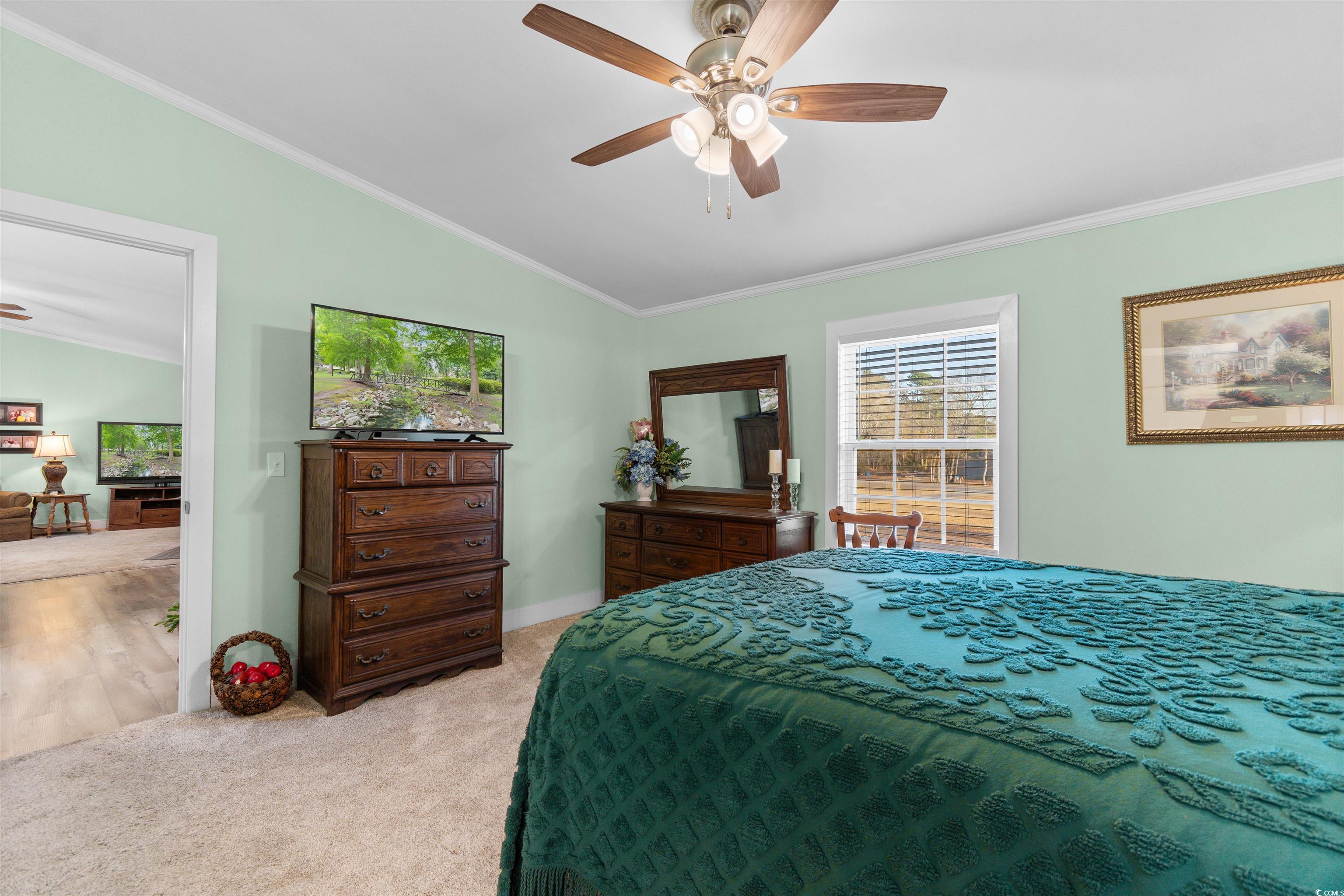 4065 Highway 66 Loris, SC 29569 - Photo 15 of 40 Bedroom featuring lofted ceiling, crown molding, light colored carpet, and a ceiling fan