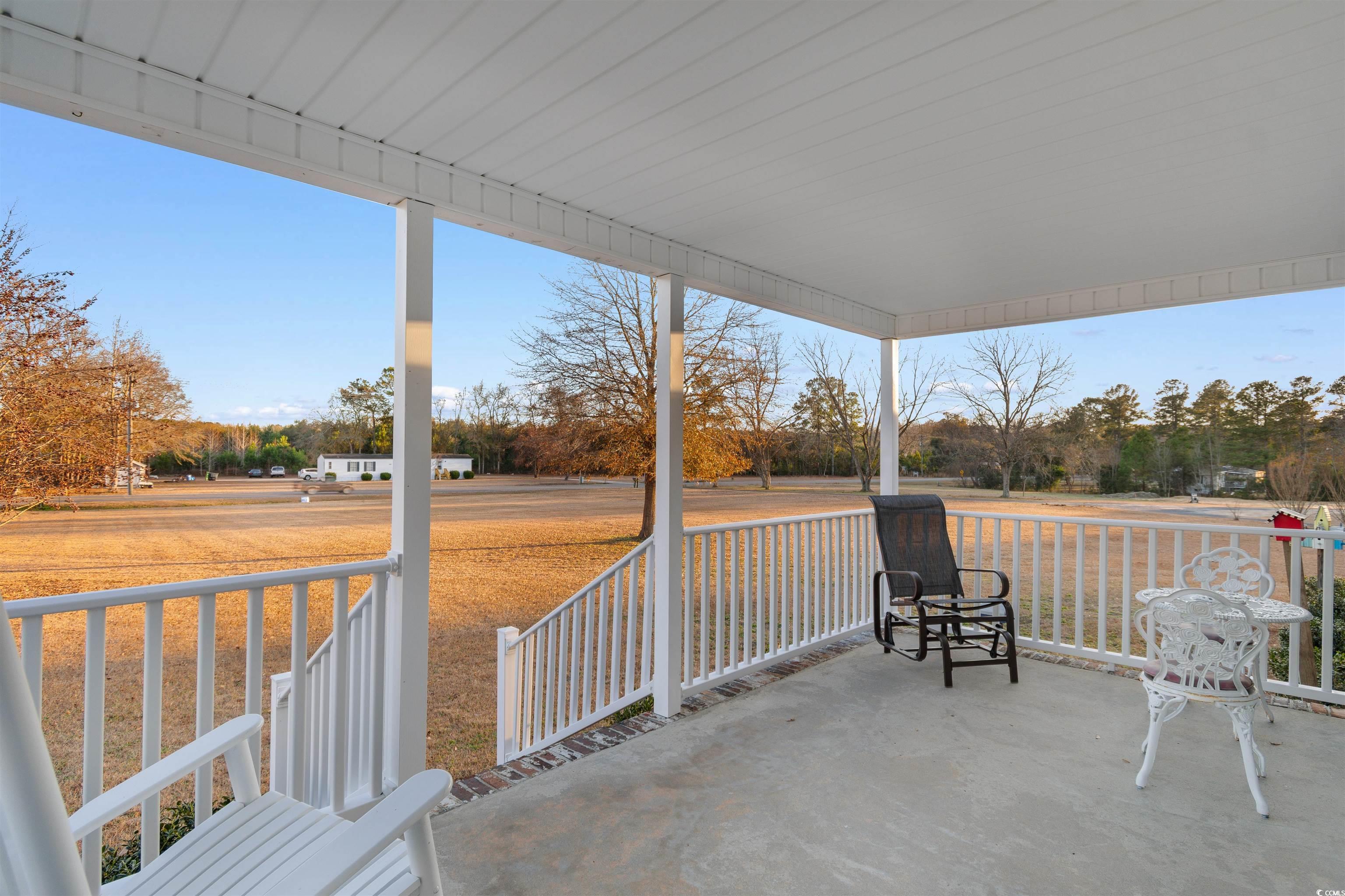 4065 Highway 66 Loris, SC 29569 - Photo 25 of 40 Porch with view of scattered trees