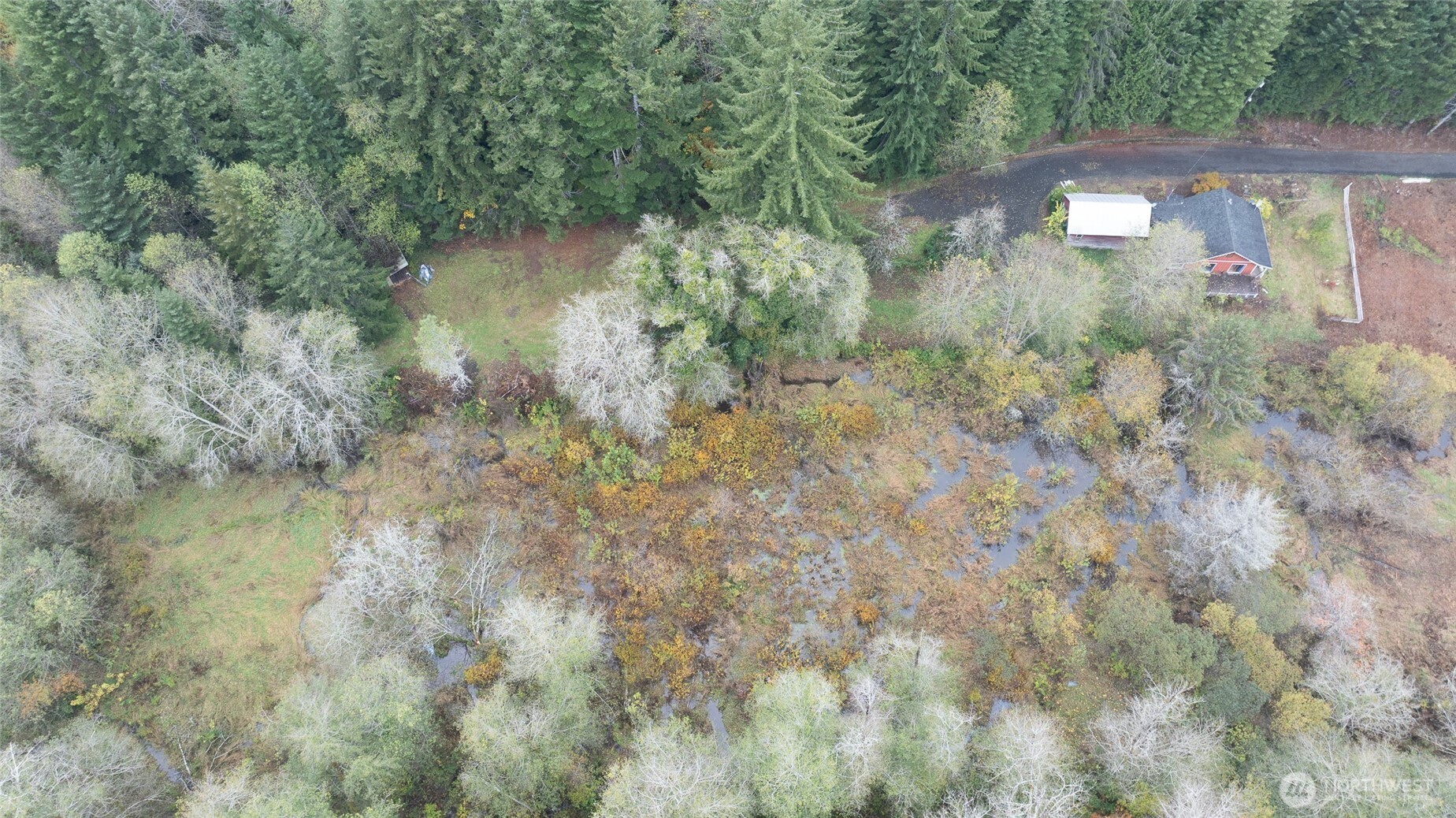 763 Geissler Road Montesano, WA 98563 - Photo 13 of 31 a view of a lake with a yard