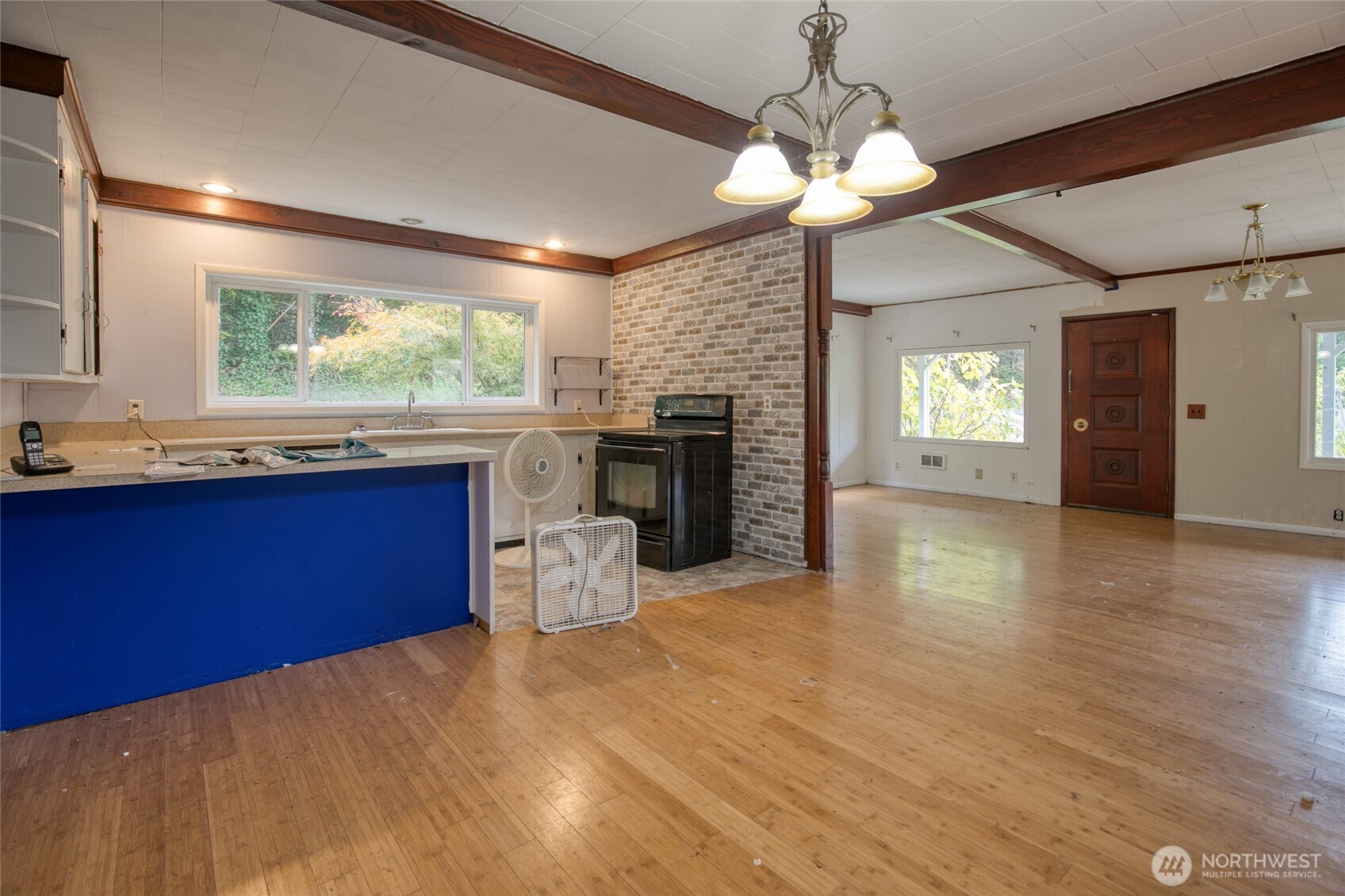 763 Geissler Road Montesano, WA 98563 - Photo 20 of 31 a kitchen with kitchen island a stove a counter top space and wooden floor