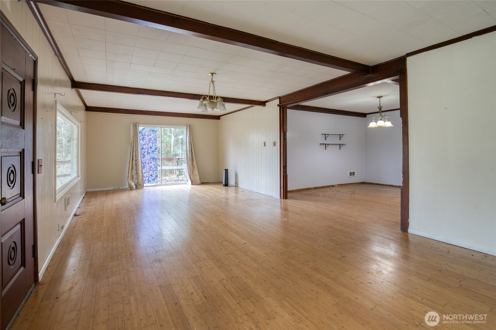 763 Geissler Road Montesano, WA 98563 - Photo 24 of 31 a view of an empty room with wooden floor and a window
