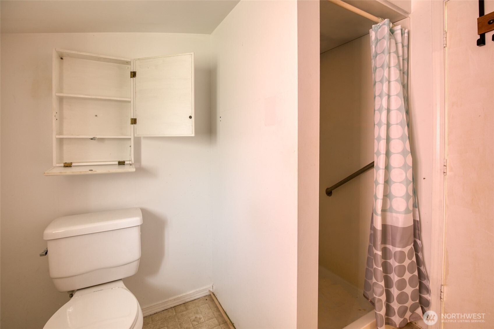 763 Geissler Road Montesano, WA 98563 - Photo 28 of 31 a white toilet sitting next to a shower curtain