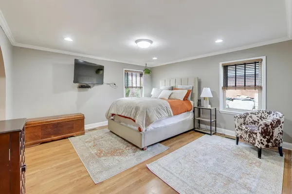 a bed room with a bed and a television