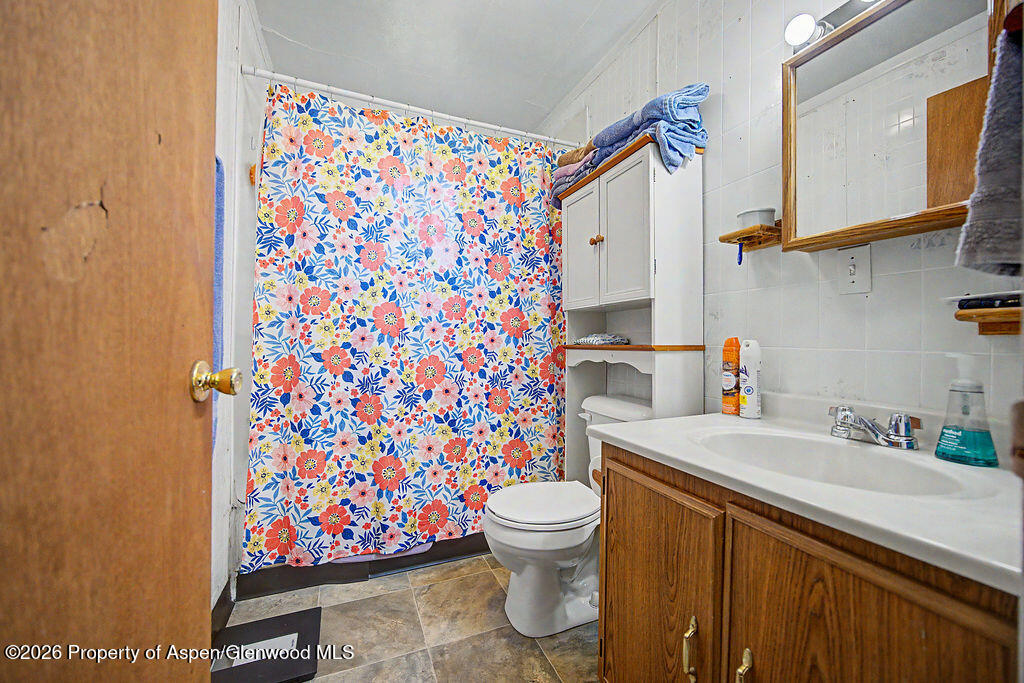 625 Russell Street Craig, CO 81625 - Photo 25 of 35 a bathroom with a sink toilet and shower