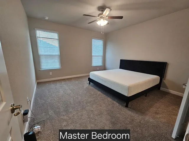 a room with a bed and window